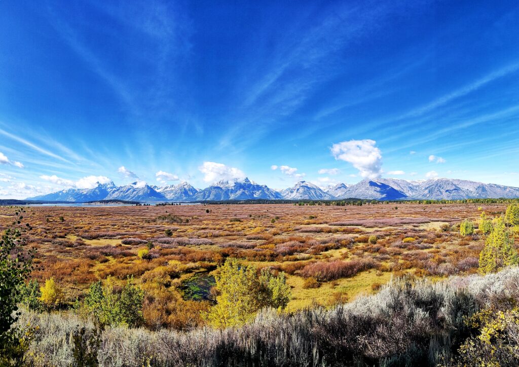 View of the Grand Tetons from Jackson Lake Lodge in Wyoming where economists and central bankers from around the world convened August 24-26, 2023 for the annual Jackson Hole Economic Symposium. Source: Wikimedia Commons